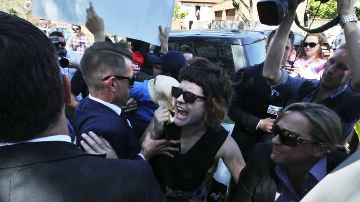Tony Abbott faced vocal protesters when he arrived at Athelstane Public school near Arncliffe to support the Liberal candidate, Nicholas Varvaris. Photo: Nick Moir