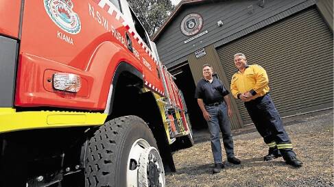 Foxground Rural Fire Service Senior Deputy Captain Con Goik and Captain Phil Butt in front of the station with one of the vehicles. Kiama Council has resolved to purchase Foxground Rural Fire Brigade's station.  Photo Dylan Robinson