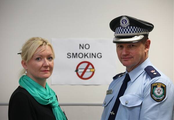Lake Illawarra Local Area Command Superintendent Wayne Starling with Cancer Council NSW’s community and events partnership coordinator Amanda Buikstra. They are working together on a stop-smoking program for the command.   DYLAN ROBINSON