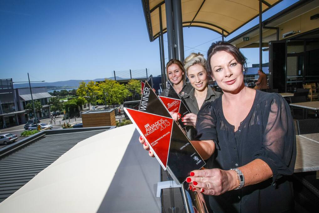 Central Hotel general manager Belinda Bleimuth (front) with staff members Kelly McLennan (left) and Demi Hoppo and the trophies they won. Picture: DYLAN ROBINSON