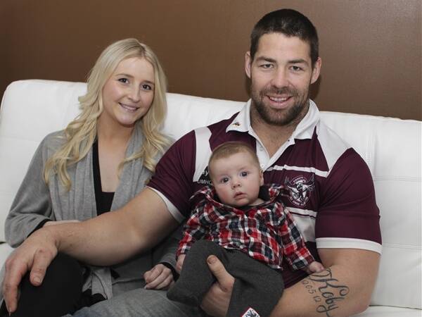 "Spud' Gray with his partner Lauren and three-month-old son Koby. Picture: DAVID HALL