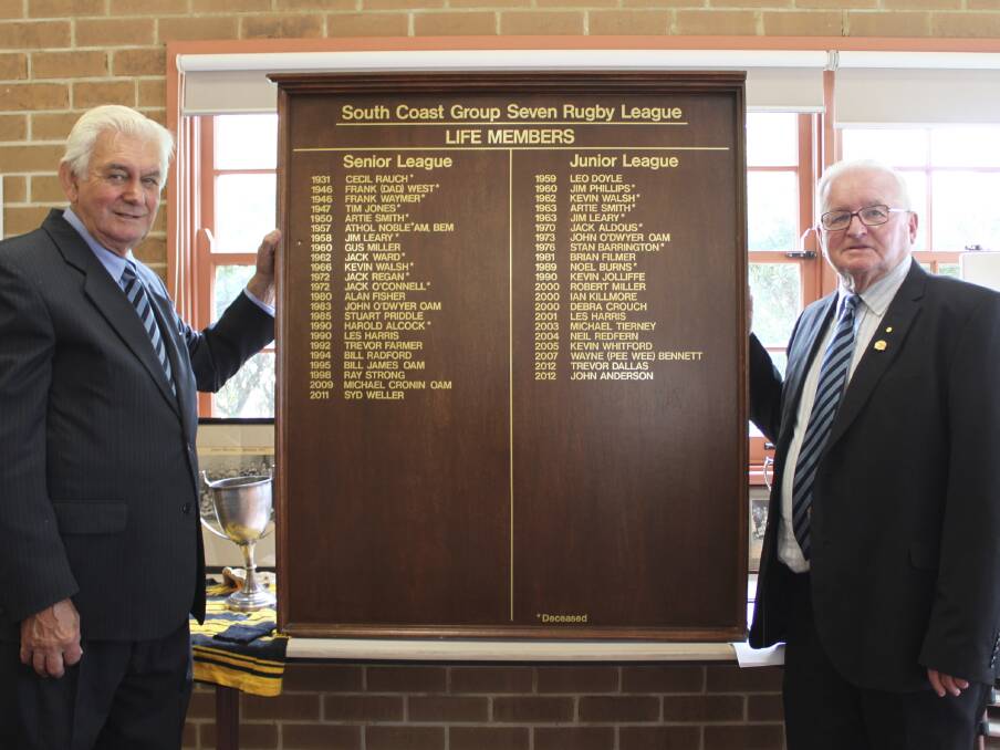 South Coast Rugby League centenary committee/life members Les Harris and John O'Dwyer unveil Group 7's new life members' honour roll. Picture: DAVID HALL