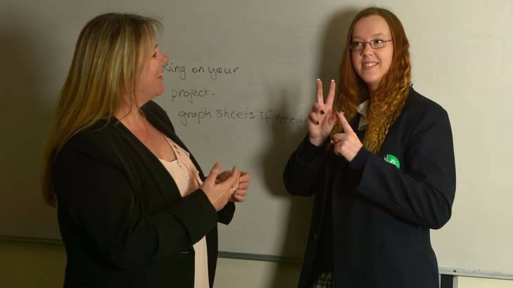 Amanda Purcell and Heidi Beasley-Ellich communicate using Auslan. Photo: Michael Clayton-Jones