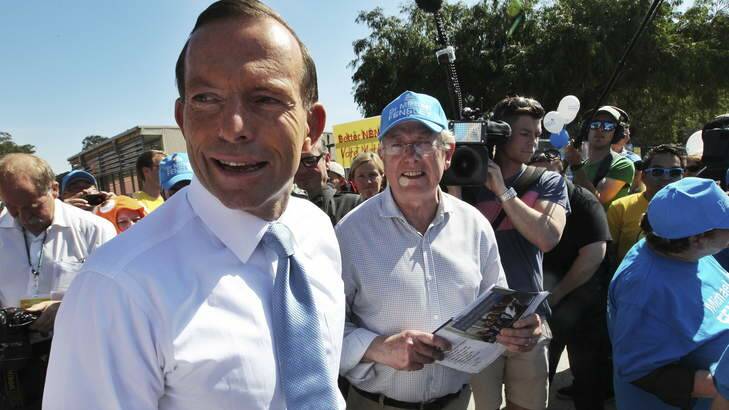 Tony Abbott meets with Liberal candidate for Kingsford-Smith Michael Feneley to hand out how-to-vote cards. Photo: Nick Moir