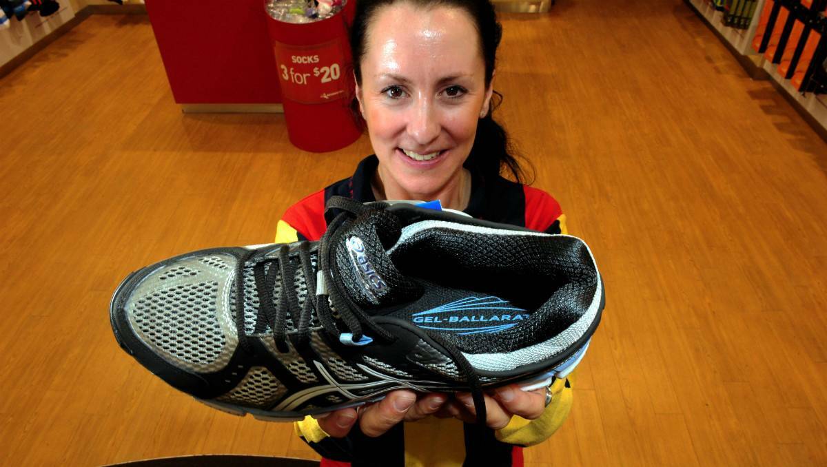 Asics has released a running shoes named after the city of Ballarat in Victoria. Here, assistant Athlete's Foot assistant manager Emma Robertson shows off the new 'Ballarat' footwear.