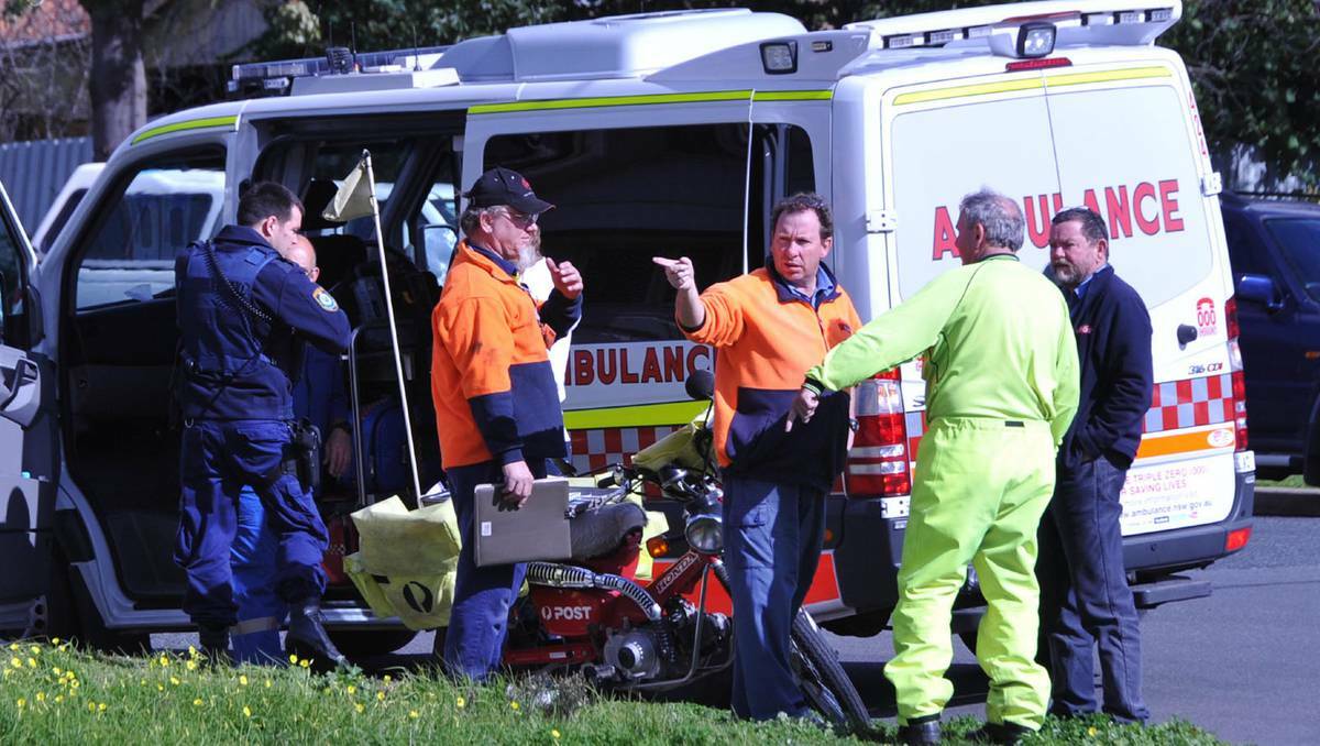 Emergency services were called to an accident in Wagga on Friday where a postie was hit by a car. Picture: Les Smith