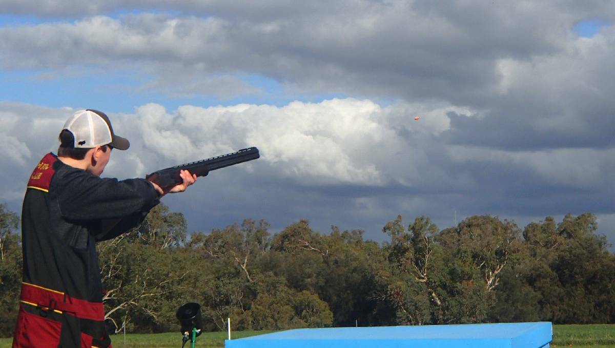 Clay target shooter Tom Richards aims at his target near Northam in Western Australia.