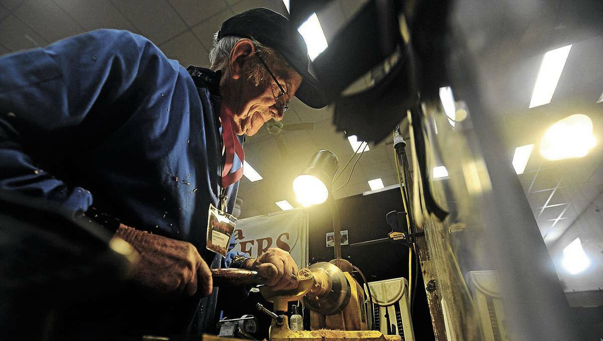 Cliff Morris is hard at work crafting wooden wares at the Craft Alive expo in Wagga, NSW on Friday. Picture: Addison Hamilton