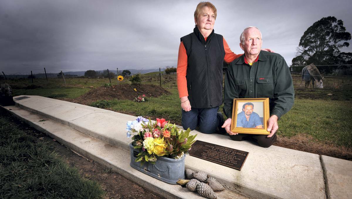 Barbara and Rob Barker pause for reflection at son Shane's grave at Campbell Town in Tasmania. Shane was gunned down in cold blood four years ago and police haven't made an arrest.