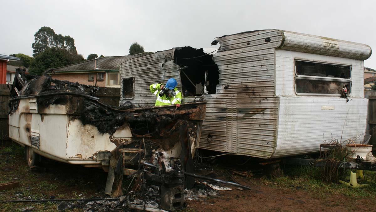 A deliberately lit fire burnt out this caravan at Shorewell Park in Tasmania. The fire had started to spread to another caravan parked next to it.