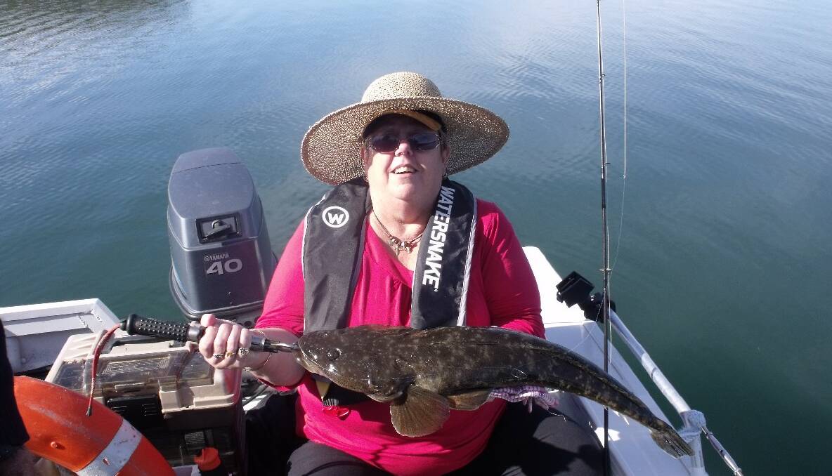 DAL FLATHEAD: Colleen Pearce from Yarram, Victoria got this beaut 70cm dusky flathead on a Z-man soft plastic fishing in Mummaga Lake, Dalmeny with local Narooma guide Bill from Calm Water Charters. The fish was released. (16/10/2013)