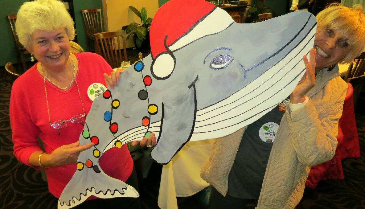 NAROOMA: Narooma Rotarians Chris O’Brien and Angie Ulrichsen are taking orders for Narooma’s Christmas whales and are pictured holding one the smaller whales available to hang on or inside local businesses. 