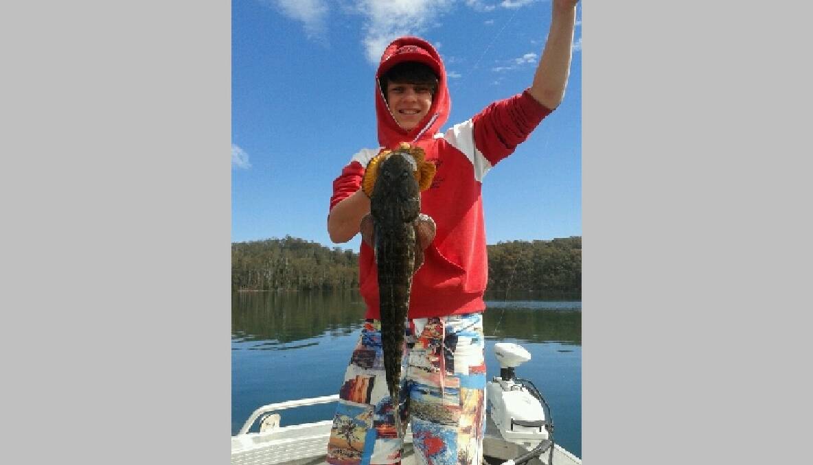 WAGOMGA FLATHEAD: Riley Bowater with a flathead from Wagonga Lake at Narooma. 