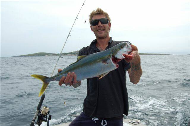 ANOTHER KING: Aaron from Canberra with a 68cm kingfish caught with Narooma Fishing Charters on Sunday at Montague Island. (24/12/2013) 