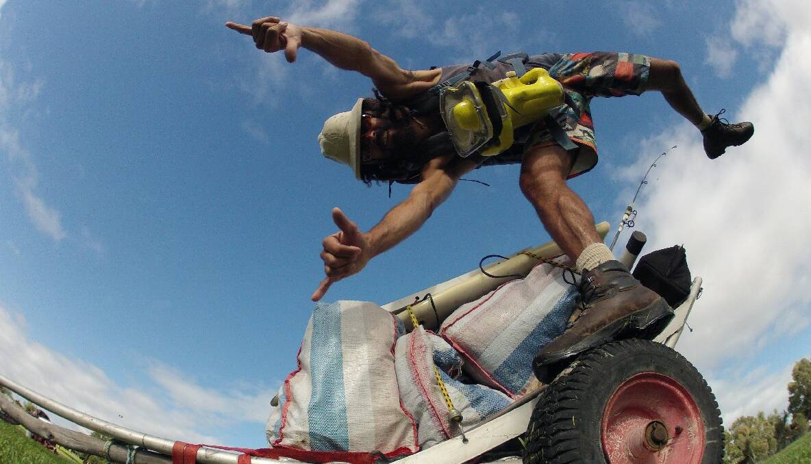 NAROOMA: Benjamin Safari jumps for joy over in WA after finishing the latest leg of his epic solo walk across the Great Australian Bight.