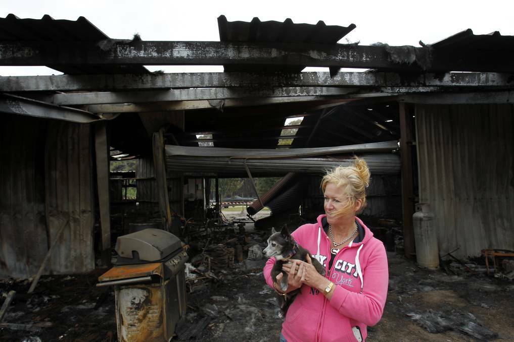 NEWCASTLE HERALD: Michelle Byrne, whose home dog grooming business burnt down along with the family's shed on Cabbage Tree Road, Williamtown. Picture: Max Mason-Hubers 