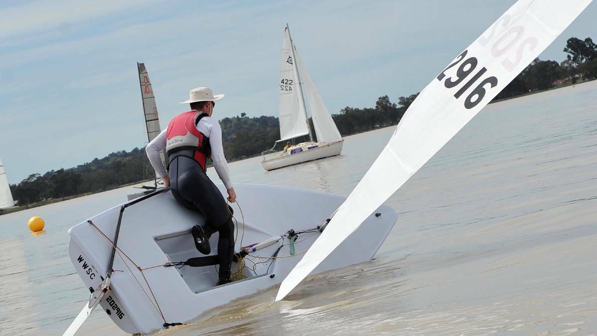 DAILY ADVERTISER: Greg Williams gets his Laser keeled over during the Wagga Sailing Club regatta on Lake Albert. Picture: Michael Frogley 