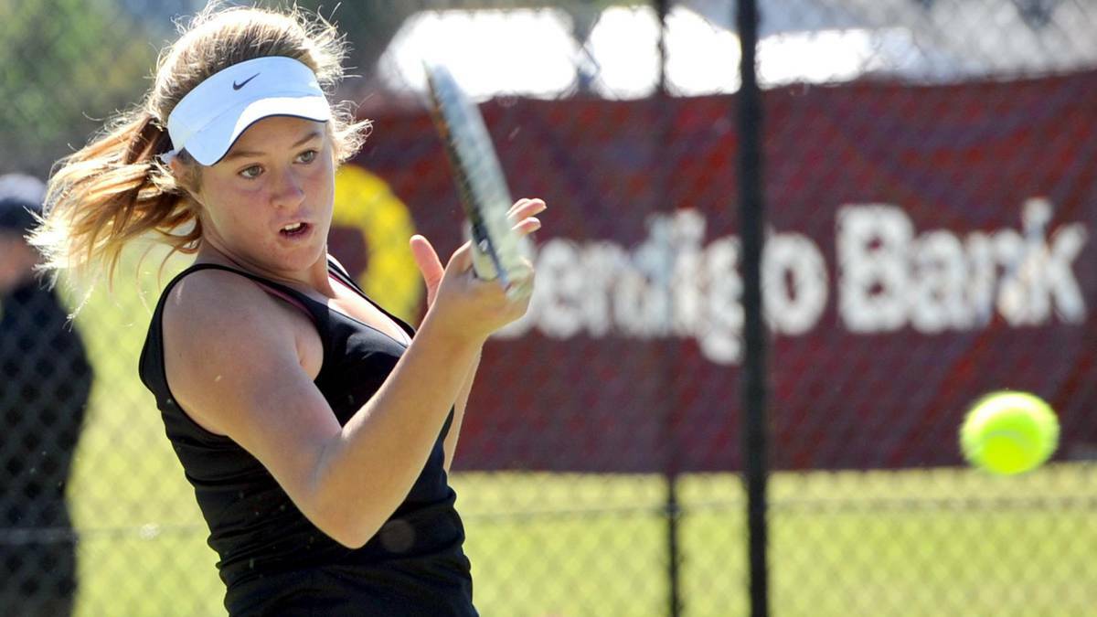 DAILY ADVERTISER: Kaitlin Staines, 13, cracks a forehand on the way to winning the Riverina Open. 
