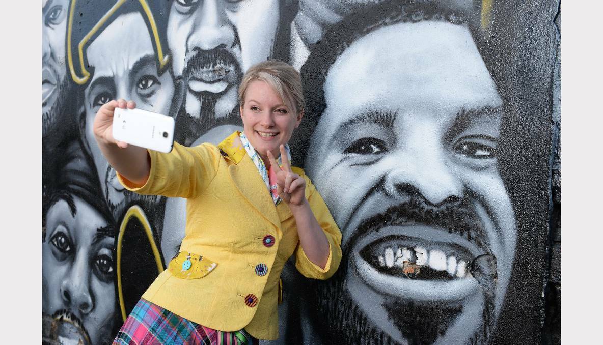 THE COURIER: Liana Skewes promoting a new Courier competition trying to get people posting their favourite photos of Ballarat on Instagram. PHOTO: KATE HEALY
