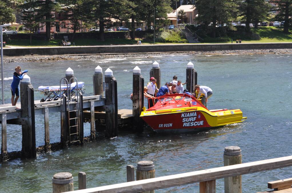 The Kiama Jet Rescue Boat delivers a 12-year-old boy who was speared in the leg to Kiama Harbour for treatment. Picture: DANIELLE CETINSKI