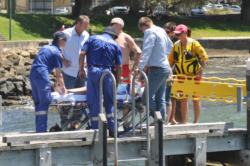 Emergency services help a 12-year-old boy who was speared in the leg. Picture: DANIELLE CETINSKI