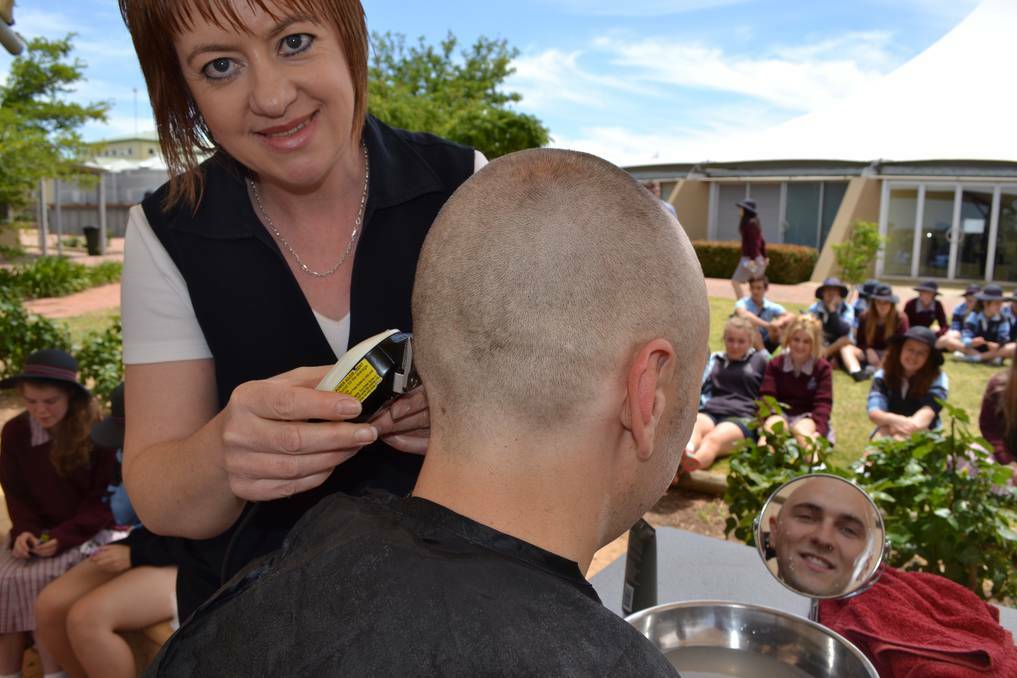 MURRAY VALLEY: Unity College teacher Benjamin Gallasch gets the finishing touches of his shave from music assistant and resident hairdresser Tania Klemm