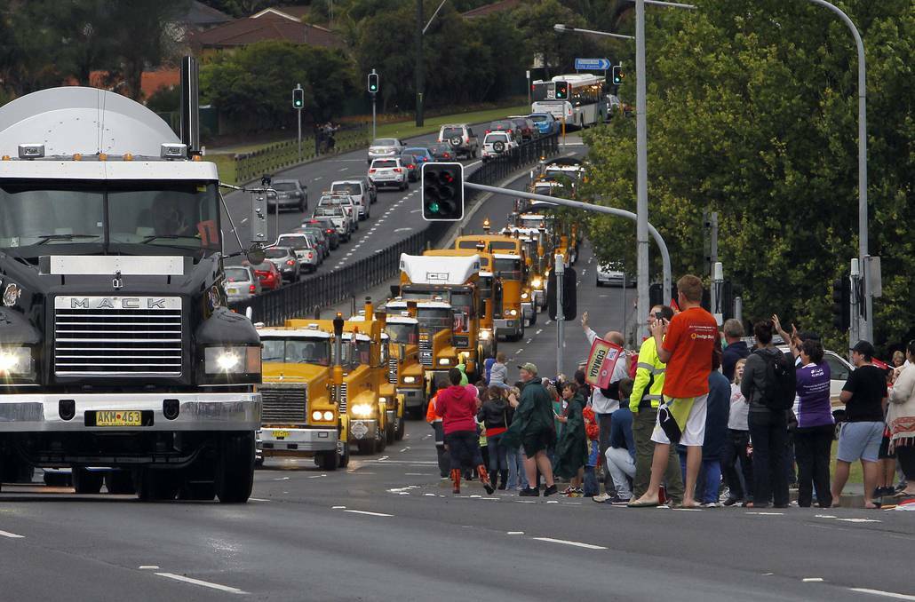 ILLAWARRA: Crowds gather along Lake Entrance Road for the 2013 i98FM Camp Quality Convoy for Kids. Picture: ANDY ZAKELI