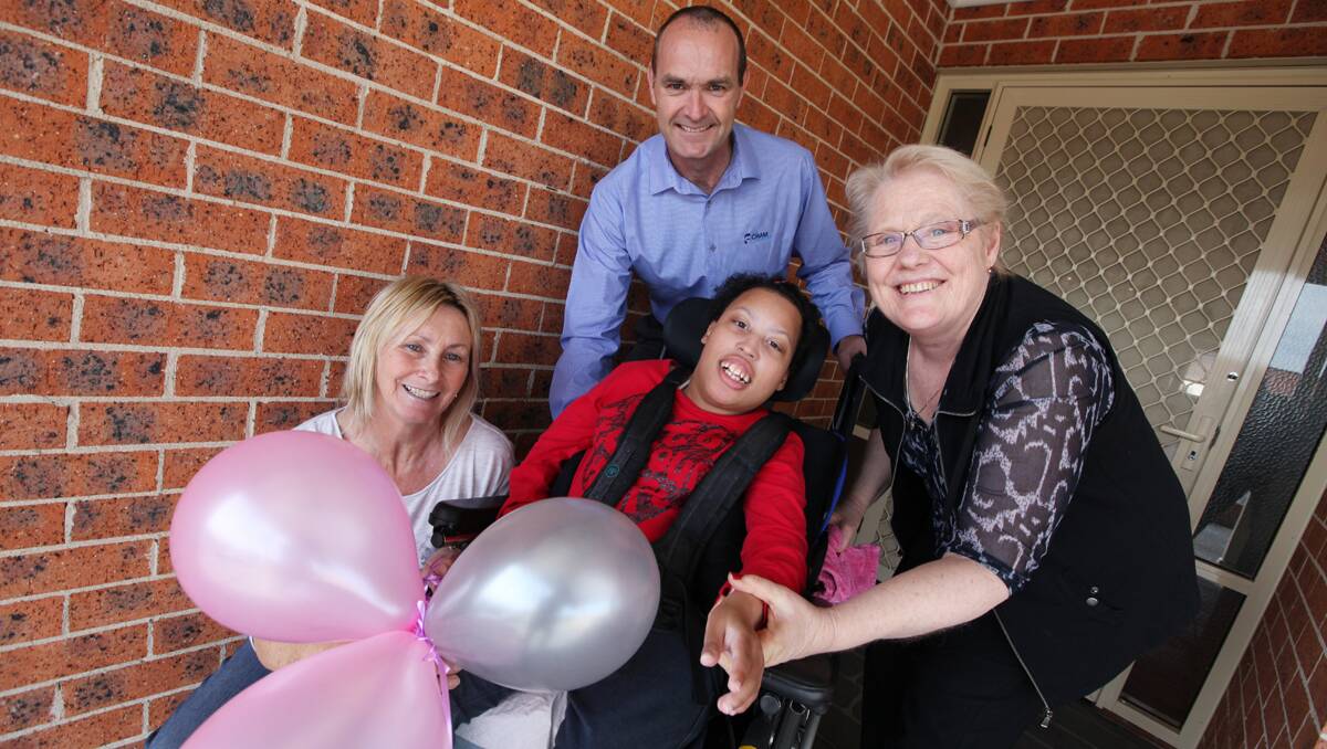 Kathy Kelly, Gareth McKeen and Diane Wood with client Jordan Wilson. Picture: DYLAN ROBINSON