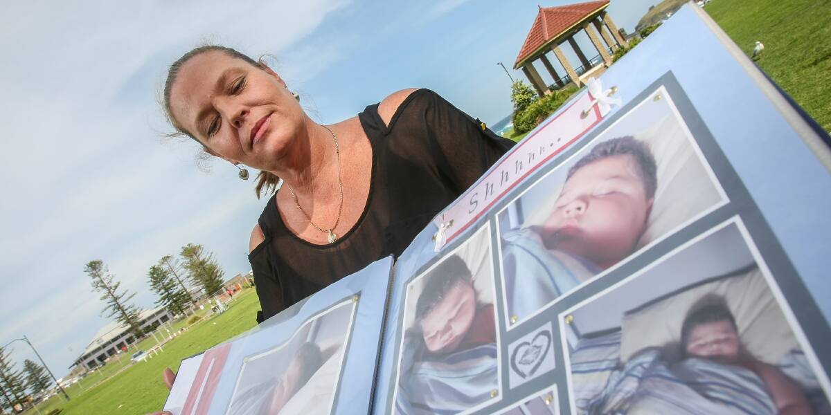 Jodie Carr with an album of photos of her late son Corey-Paul. Picture: DYLAN ROBINSON