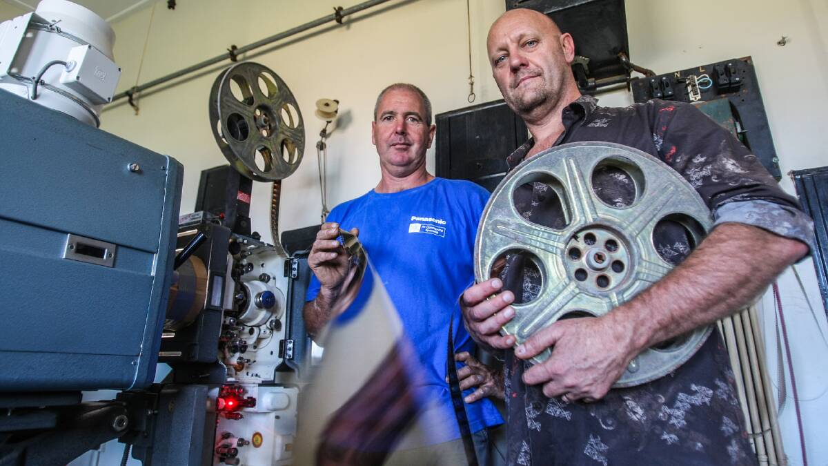 End of an era in film - Pics & Flicks president Charles McCammon (right) with long-time projectionist Gary Waghorn. Picture: DYLAN ROBINSON