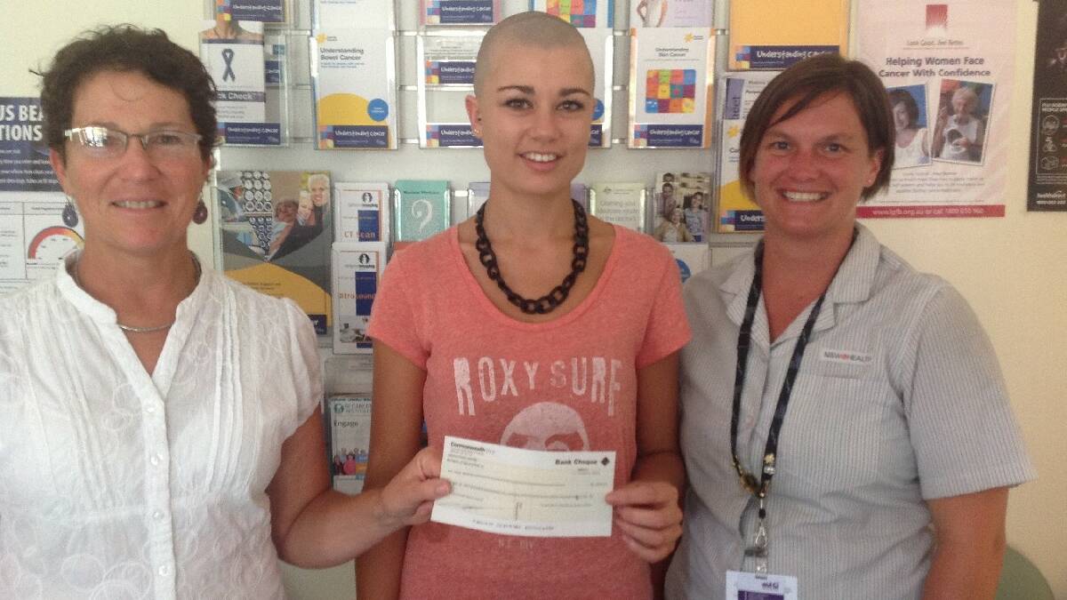 MERIMBULA: Nancy Spicer, oncology RN, left, Merimbula hairdresser Kristy-Anne Rich, and Melissa Mudie, cancer care co-ordinator with the cheque for $1700 raised by Kristy-Anne who shaved for the Bega oncology unit.