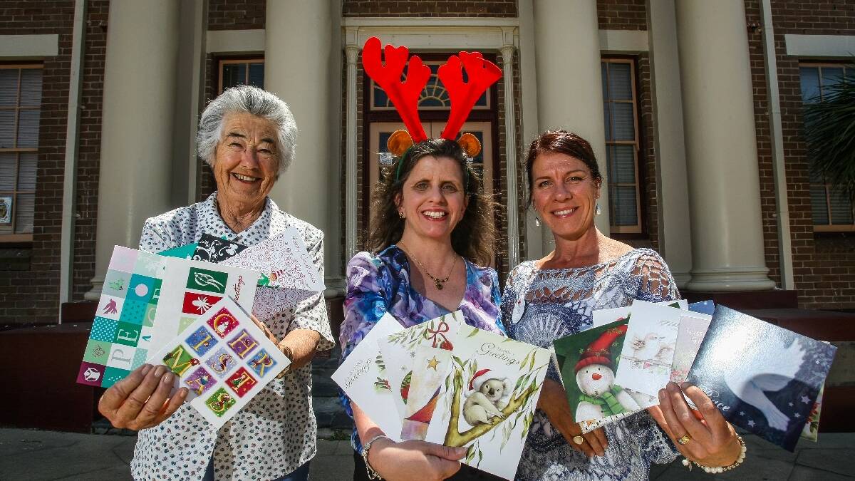 KIAMA: Kiama Red Cross is holding its annual Christmas Card Shop to raise funds for several different charities. Red Cross members Gwen Hinchliffe, Heidi Smith and   Vicki Robb with cards. Picture DYLAN ROBINSON