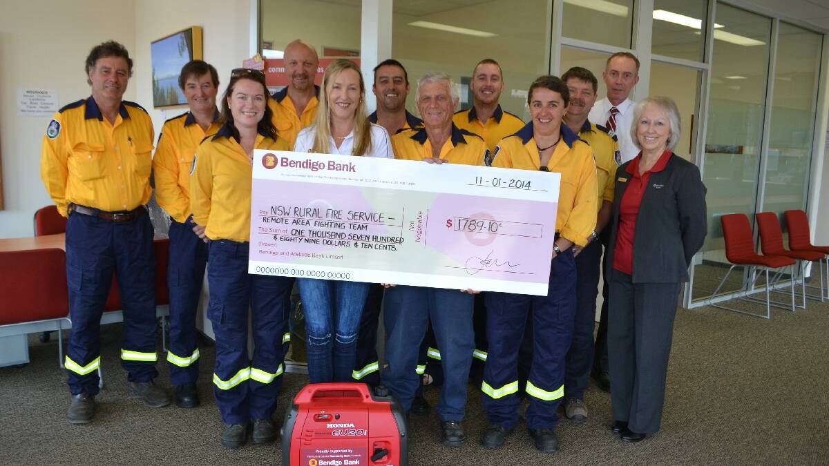 PAMBULA: The Pambula and District Community Bank has donated $1789.10 to the Bega Valley Remote Area Firefighting Team for a generator to charge radios in the field.  Pictured are: Front from left; Nic Cooper (Merimbula), Kim Stevenson (Pambula and District Community Bank manager), Jim Everbach (Wolumla), Bec Turner (Tathra), Belinda Grundy (Pambula and District Community Bank). Back from left: Paddy Jennings (Candelo), Rick Jennings (Candelo), Garry Cooper (Angledale), Mark Ayliffe (Cobargo), Jesse Hardy (Cobargo), Peter Reynolds (Pambula) and Philip Smith (Pambula and District Community Bank). Absent: Lindsay Scullin (Bega), Brock Scullin (Bega), Simon Bateman (Numbugga), Patrick Waddell (Bermagui).