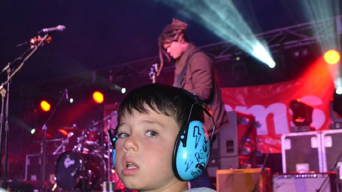  NAROOMA: The Great Southern Blues Festival at Narooma attracts blues fans of all ages including this young fun of unknown origin watching   Ash Grunwald on Sunday. Earmuffs were indeed the order of the day with many kids sporting the ear protection.