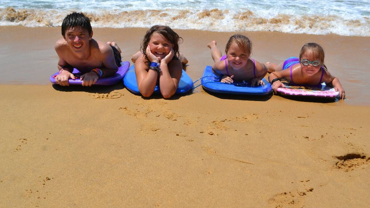 EDEN: The Lamont family from Queanbeyan found a great way to beat the heat and stay cool in the surf at Aslings Beach this week. From left they are AJ (14), Taylor (9), Zoe (7), and Chenille (6) Lamont.