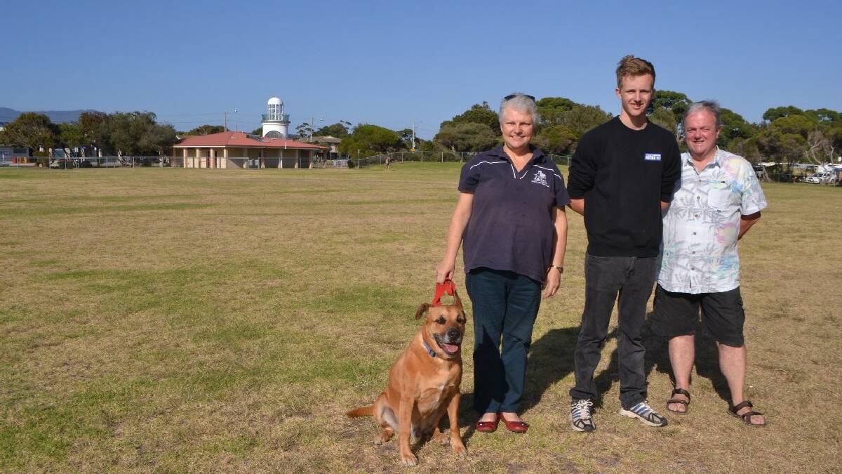  NAROOMA: Meeting on NATA Oval over the weekend to discuss moving on from fence issues are local Animal Welfare League branch representative Daiva Ceicys and her dog Titan, youth committee member Ben Potter and deputy mayor Neil Burnside.