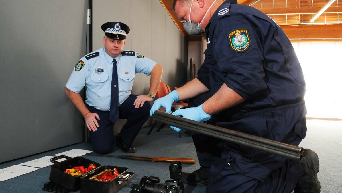 Detective Acting Inspector Gareth Smith with Senior Constable Cameron Wells, a forensic officer attached to Bathurst Crime Scene, during a   weapons seizure. Picture: Zenio Lapka
