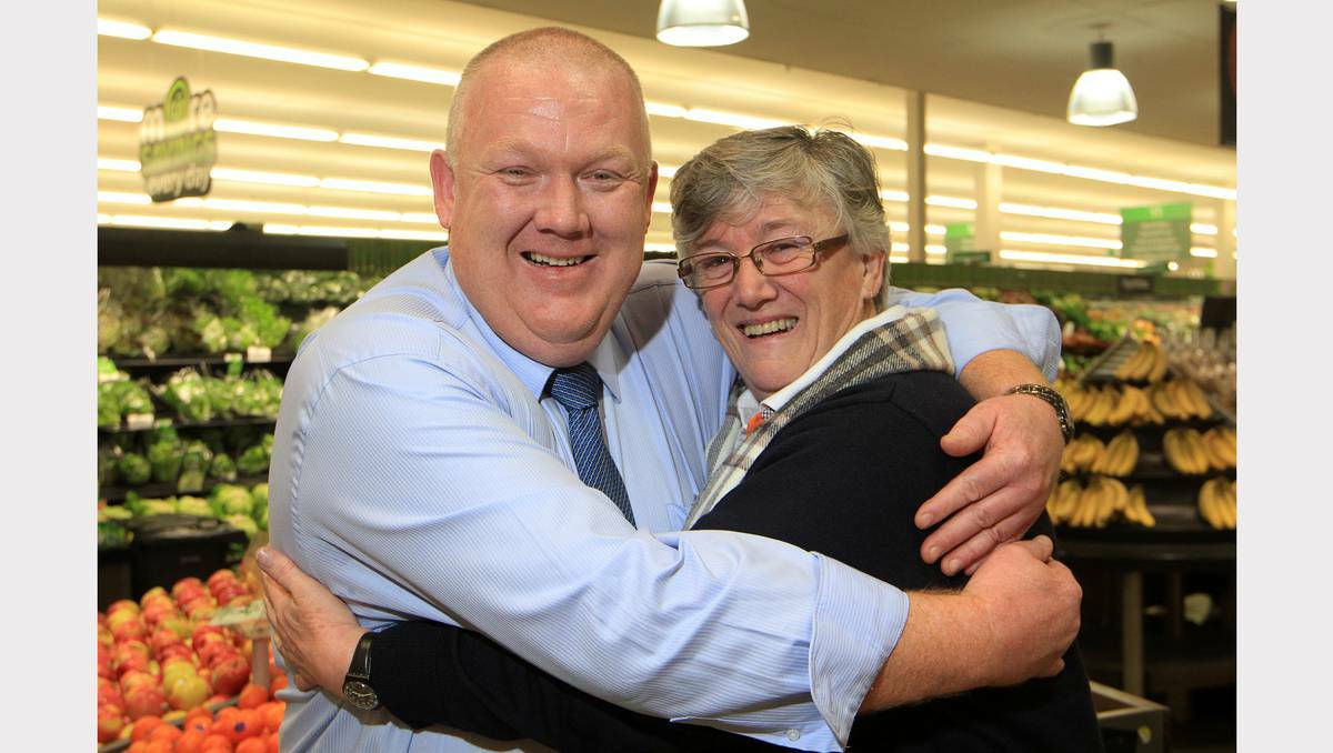 Devonport Show Society president Lesley Young gives Woolworths' Devonport store manager Kerry Porter a thankyou hug after the company pledged a total of   $90,000 in sponsorship over three years for the show. Picture: Meg Windram.