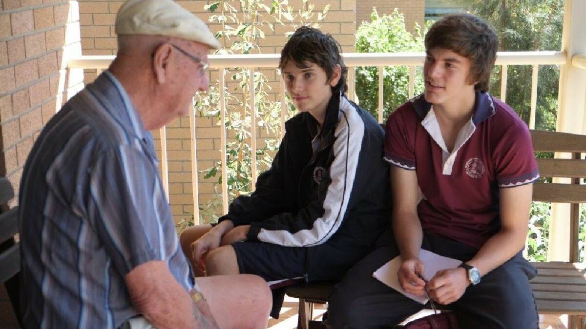 ULLADULLA: Shoalhaven Anglican School students David Passlow and Jake Adlam interview Sarah Claydon Retirement Village resident Ken Mawby as part of the My Story Matters program.