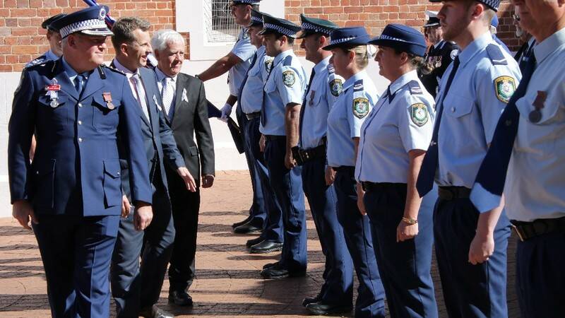 BEGA: Inspecting the honour guard at National Police Remembrance Day is (from left) Inspector Jason Edmunds with Member for Bega and Mayor Bill Taylor.