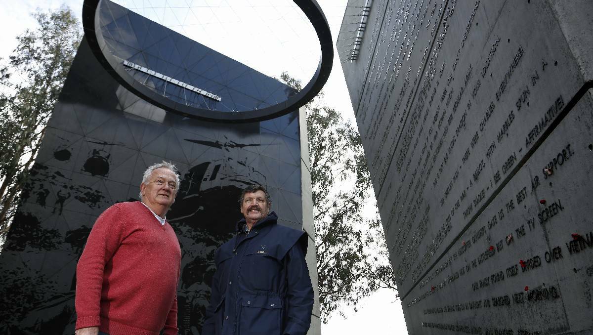 Vietnam veterans Ross Benton of Bendigo and Brian Pender – formerly of Bega – meet for the first time in 43 years at the Vietnam Memorial in Canberra. Picture: Jeffery Chan
