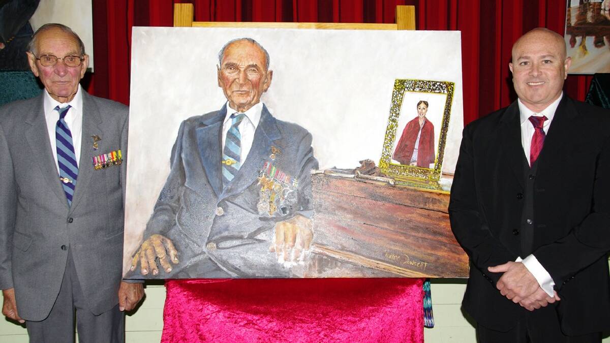 BOMBALA: Bendoc WWII veteran, Keith Bent with the stunning portrait of him that was unveiled by visiting artist, Wayne Donwsent during the   Anzac Portrait Exhibition held in Delegate on Saturday.