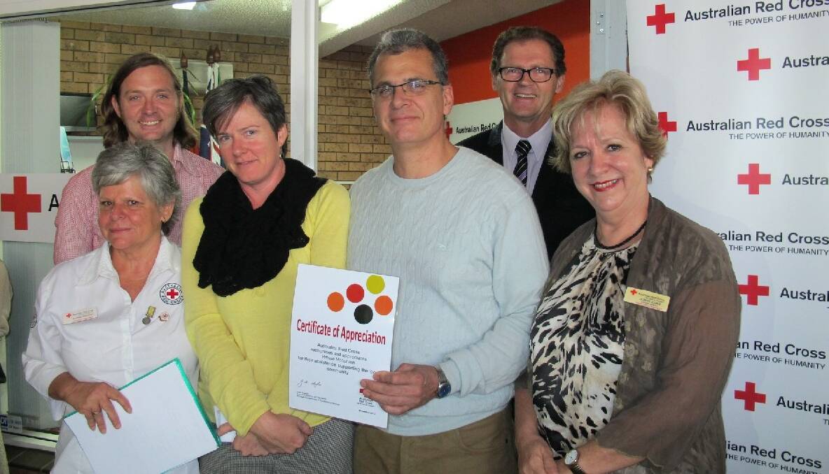 NAROOMA: Pictured at the new Red Cross hub at Narooma are Red Cross workers Shanna Provost and Tom Noonan with supporters Jen Houghton-Deveson and Matt Deveson, mayor Lindsay Brown and ACT/NSW Red Cross director Joan Hughes Joan Hughes.