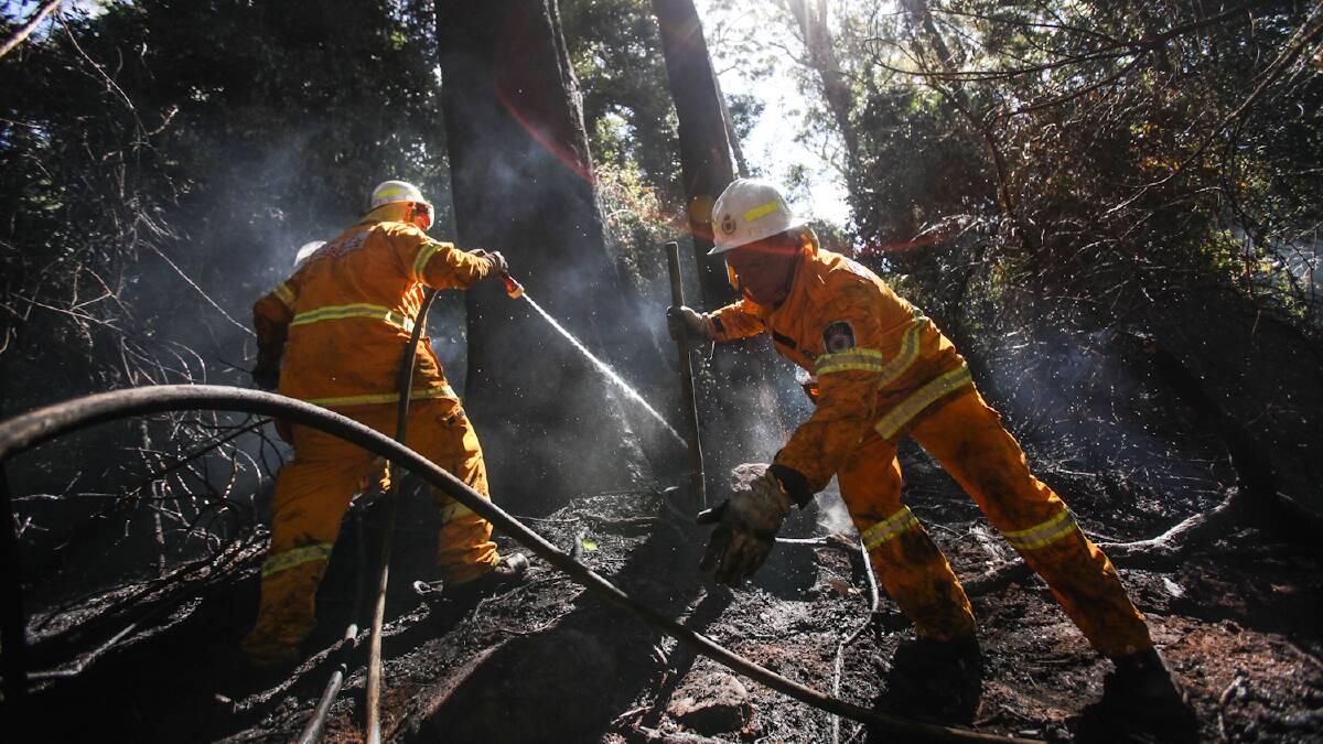 Local fire fighters battle a blaze near Jamberoo. Picture: DYLAN ROBINSON