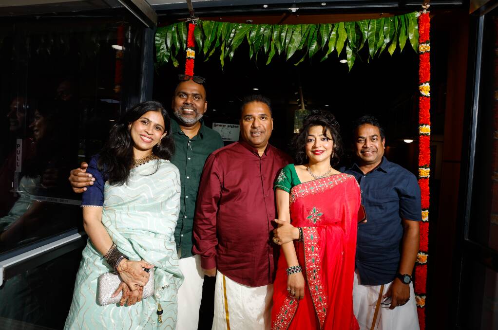 Mariam Haja, Naushad Ahamed, Vaidya Bala, Shweta Balaand Siva Maikandanathan standing under mango leaves at the Tamil New Year celebrations on April 14. Picture by Anna Warr