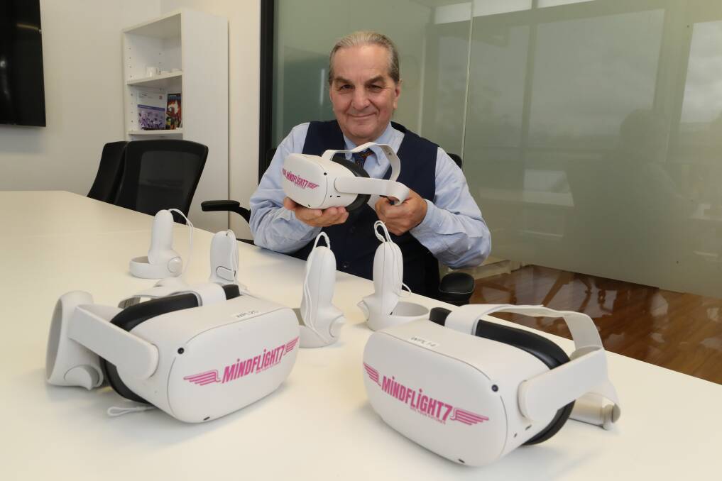 Marty Burgess from Workplace Learning Australia with the Mindflight 7 VR headsets that offer more than 100 experiences for students to try. Picture by Robert Peet