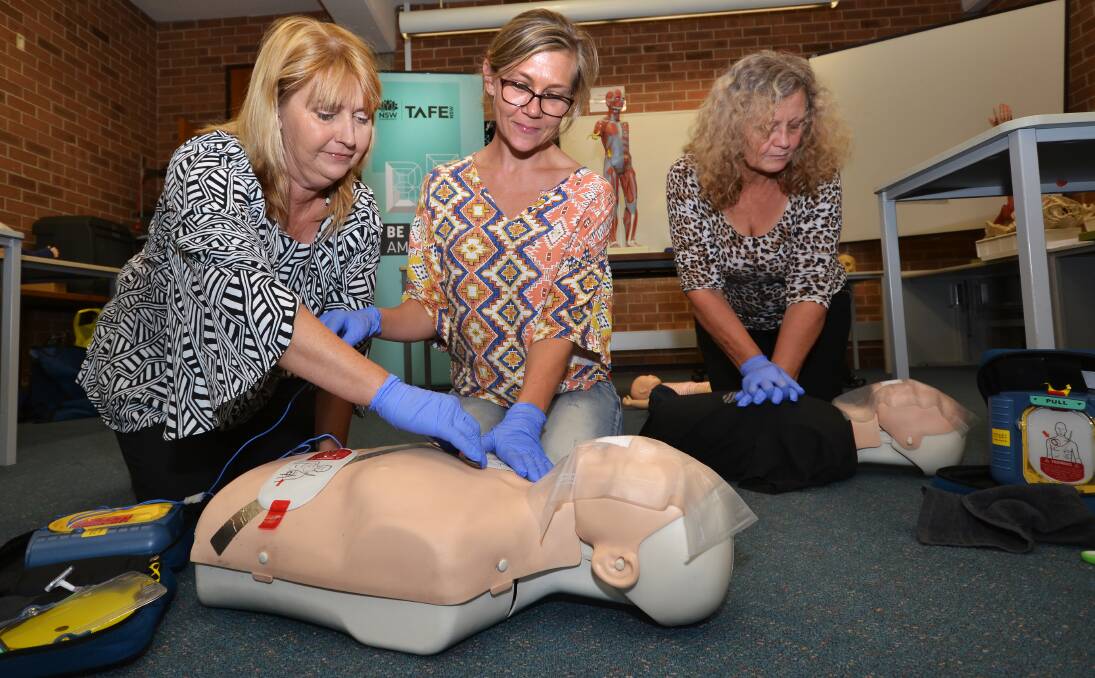 TAFE NSW Shellharbour First Aid teacher Georgie McInerney offers life-saving skills to student Sandra Davis.