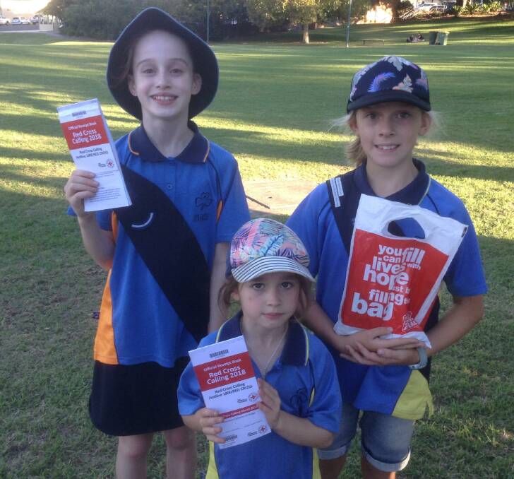Girl Guides Chloe Piggins, Ada Heald and Nyah Woollett assist with the 2018 Red Cross Calling fundraiser.