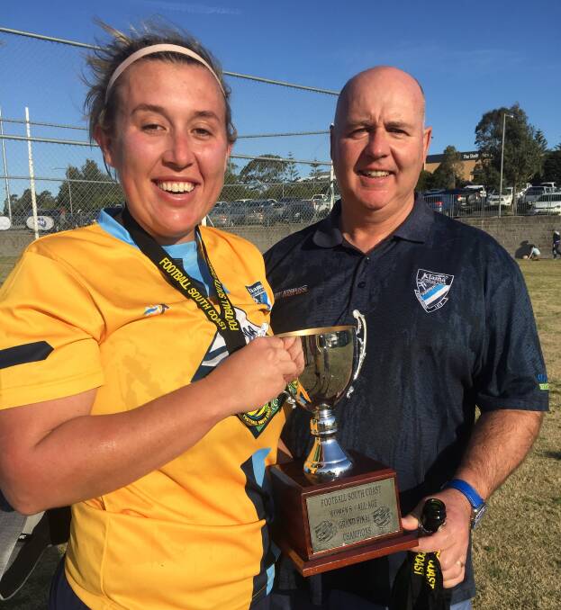 ALL SMILES: Captain Hayleigh Beringer and coach Neil Spence are elated after the Kiama Quarriers take out the Division 3 women’s South Coast Football grand final.