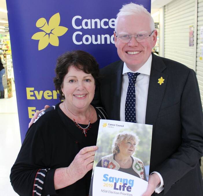 Cancer Advocacy Network volunteer Moira Etheridge presents Kiama MP Gareth Ward with the Saving Life 2019 election priorities document.